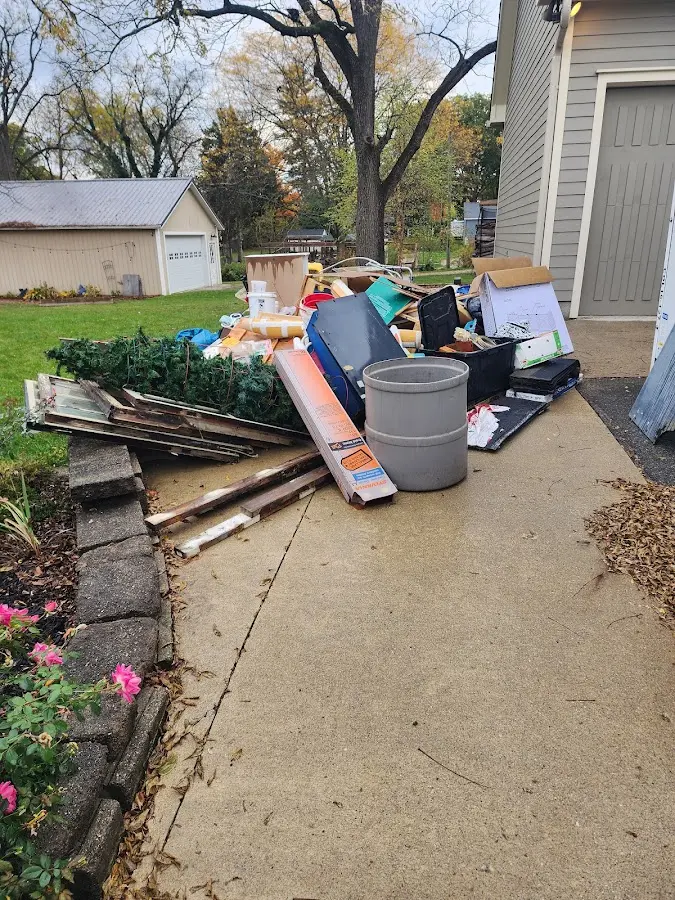 Dumpster being loaded with debris for 30 Yard Dumpster Rental in North Stonington